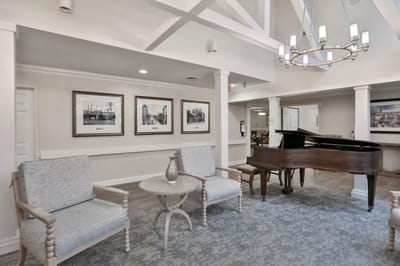 Cozy lounge area with seating and piano