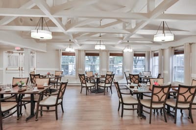 Elegant dining room with wooden tables and natural light