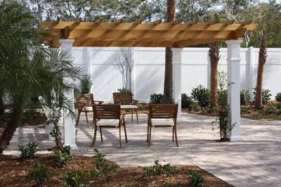 Outdoor seating area with pergola and plants