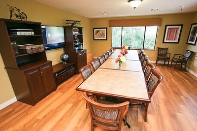 Interior common area with a large table and chairs