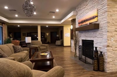Cozy interior common area with seating and fireplace