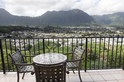 View from a balcony overlooking a valley and mountains