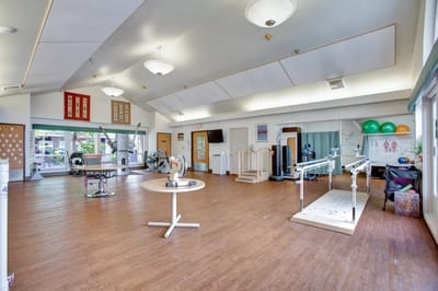 Bright and spacious exercise room with equipment