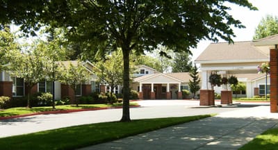 Outdoor view of the assisted living facility with trees