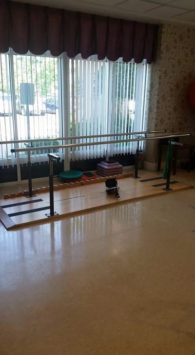 Rehabilitation exercise area with a balance bar