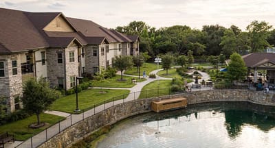 Aerial view of the facility's exterior and surrounding gardens