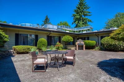 Outdoor patio space with seating and landscaping