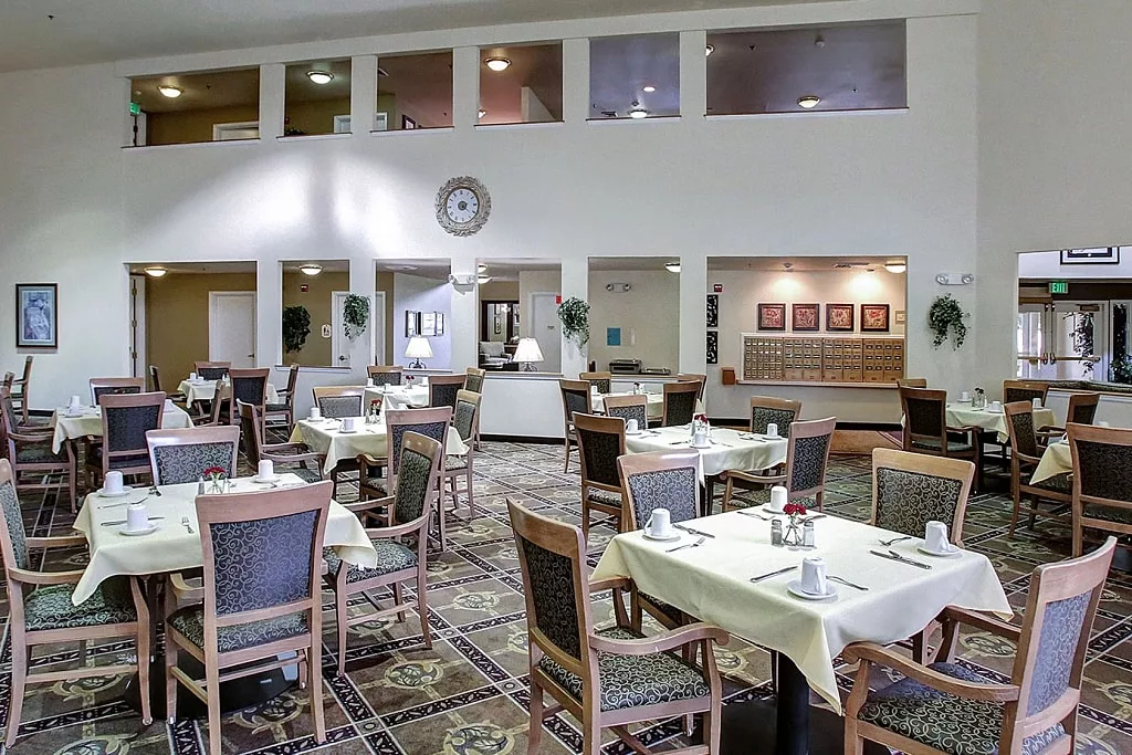 Dining room setup with tables and chairs
