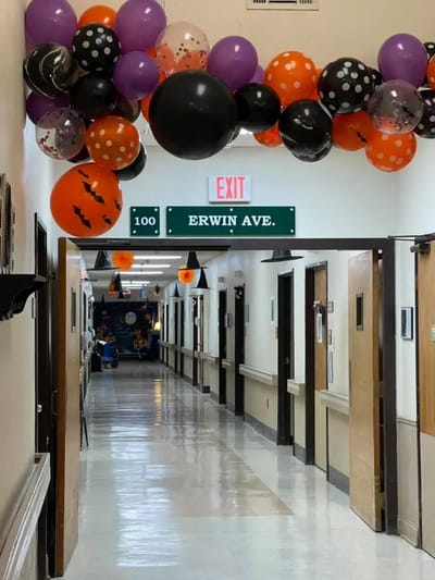 Decorative balloons in a decorated hallway