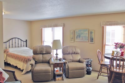 Cozy interior of a resident's room with seating and decor
