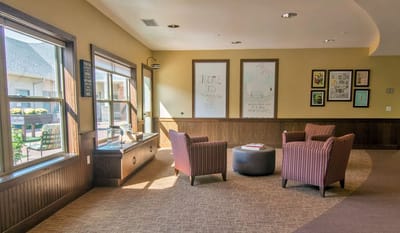 Bright common area with seating and artwork
