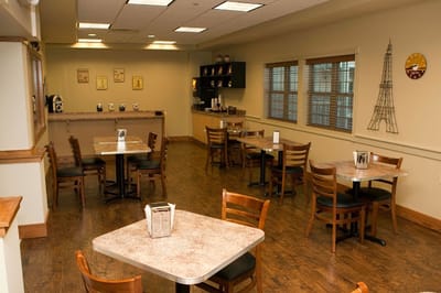 Bright dining room with tables and chairs