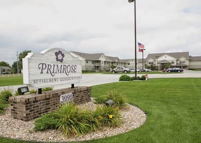 Exterior view of Primrose Retirement Community sign and building