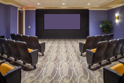 Facility interior auditorium with seating and a screen