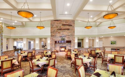 Dining area with tables and a fireplace