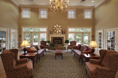 Bright common area with comfortable seating and a fireplace