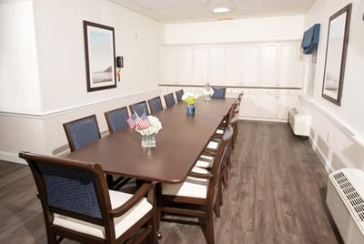 Common area with a long dining table and chairs