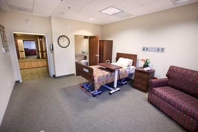 Comfortable resident room with a bed and seating area