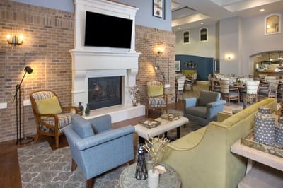 Cozy lounge area with seating and fireplace