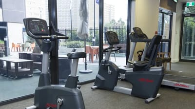 Exercise equipment in a bright fitness area