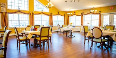 Bright dining area with tables and chairs