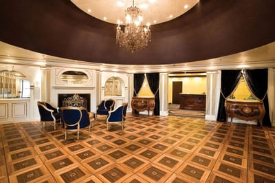 Elegant interior common area with chandeliers and chairs
