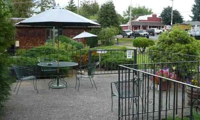 Outdoor seating area with tables and umbrellas