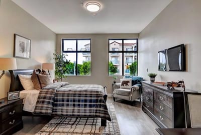 Brightly lit private resident room with modern furnishings
