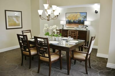 Elegant dining room setup with a chandelier