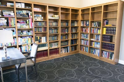 Interior common area with bookshelves and seating