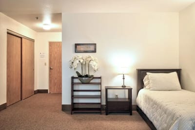 A cozy private bedroom with a bed and decor