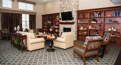 Common area with seating and bookshelves