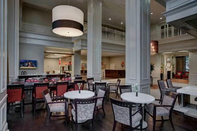 Bright common area with tables and chairs