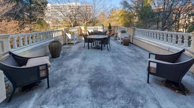 Outdoor patio area with seating and planters