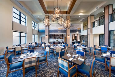 Modern dining room with stylish decor and tables
