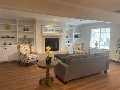 Common area with seating and decor in a bright setting
