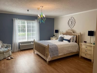 Bright private resident room with a bed and window