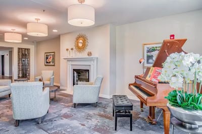 Cozy common area with piano and seating