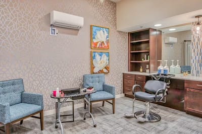 Beauty salon area with chairs and decor