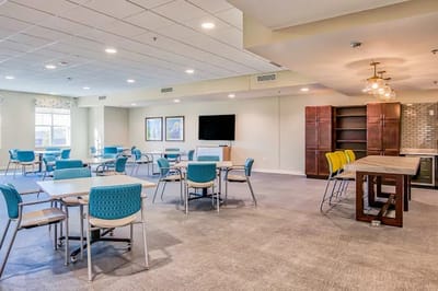 Bright common area with tables and chairs