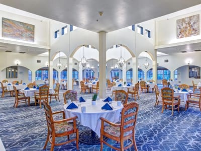 Bright dining room with elegantly set tables