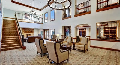 A spacious lobby with comfortable seating and decor