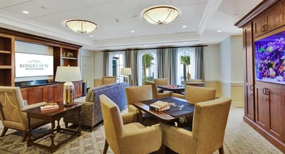 Common area with seating and decorative aquarium