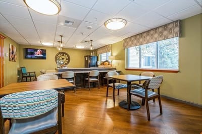 Bright common area with tables and chairs