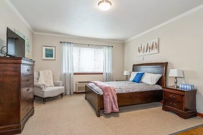 Cozy bedroom setup with bed and dresser