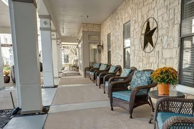 Outdoor seating area with comfortable chairs and plants