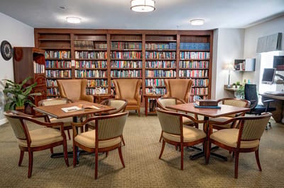 Interior common area with bookshelves and seating