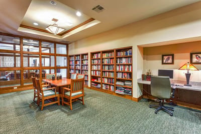 Cozy reading area with bookshelves and table