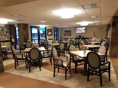 Bright and open dining area with flowers on tables
