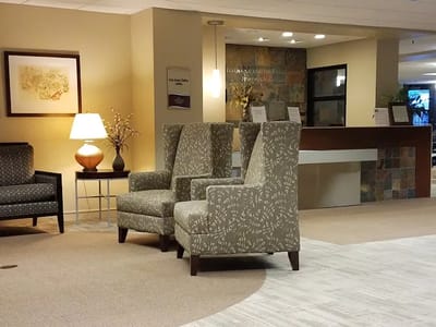Common area with chairs and artwork